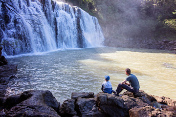 family enjoying waterfalls
