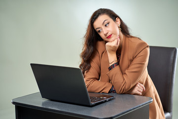 Young tech lady working on laptop