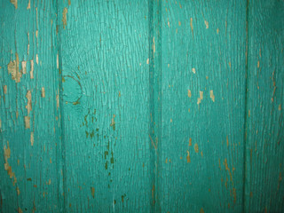 texture of vintage green old vertical boards with peeling paint