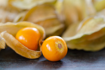 Physalis peruviana or cape gooseberry fruit on wooden table