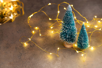 Christmas festive background with glowing garland and  fir tree. Merry Christmas and Happy New Year...