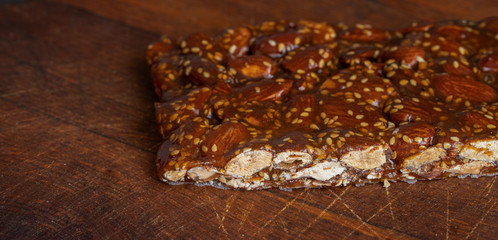 Turron de guirlache, Guirlache nougat made with almond and caramel. Traditional Christmas sweet consumed in Spain.