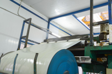 Press machine glues panel. Plant for the production of sandwich panels from styrofoam