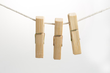 3 clothes peg on the rope white background