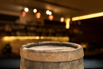 Beer barrel with beer glasses on table on wooden background