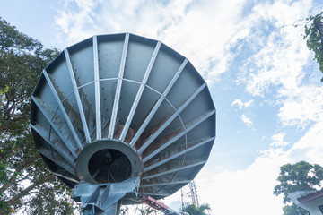 A radio telescope is a form of directional radio antenna used in radio astronomy. ,on the hill blue sky with cloud bright at Phuket Thailand.