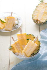 Homemade ice cream or popsicles from pineapple decorated. Top view. Frozen fruit pulp. Summer sweets