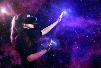 Fototapeta na wymiar Beautiful woman in virtual reality glasses on a futuristic background.