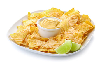 Plate with tasty nachos and sauce on white background