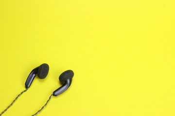 in ear headphones on blue background