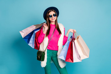 Portrait of her she nice-looking attractive cheerful cheery fashionista brown-haired girl spending free time buying addict isolated on bright vivid shine vibrant green blue turquoise color background