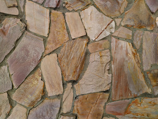 background of fragments of stone tiles in cement