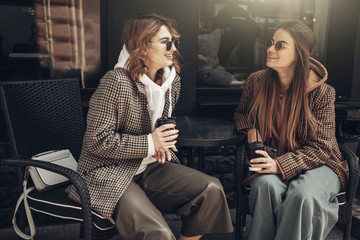 Portrait of Two Fashion Girls, Best Friends Outdoors, Coffee Break Lunch at Sunny Day