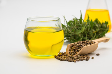Fototapeta premium CBD cannabis oil. Hemp oil and hemp seed isolated on white background. Healthy cannabis oil.