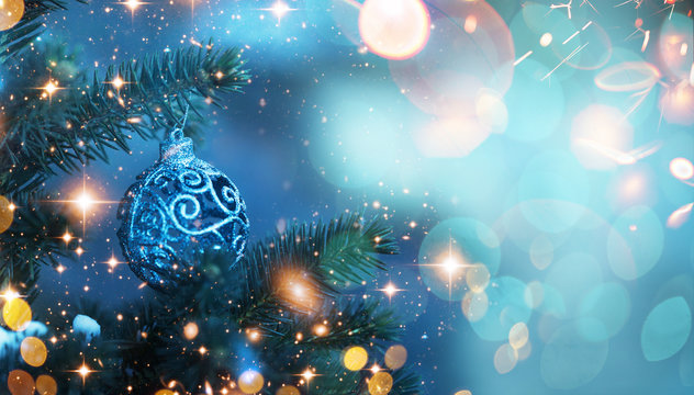 Christmas and New Year holidays background. Glitter lights backdrop. Winter season. Text space. Closeup of Christmas-tree. Elements of this Image Furnished by NASA.