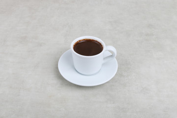 Turkish Coffee Cup - Coffee in a white cup isolated on a texture background 