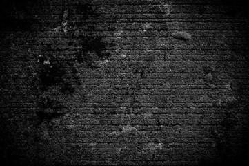 Obraz premium Wall grunge black concrete with light background. Dirty wall concrete blackboard texture and splash or abstract background.