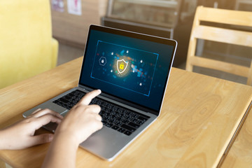 Person using a Laptop Computer with data protection, Cyber security, information safety and encryption concept. internet technology and business concept, Laptop mockup with clipping path on screen.