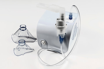 Medical equipment for inhalation with respiratory mask, nebulizer on white background.