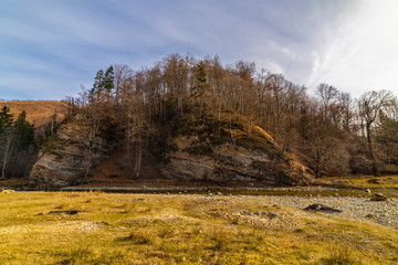 Fototapeta premium Beautiful winter landscape at the mountain with river in Romania, Carpathian Mountains