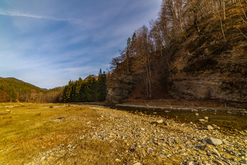 Beautiful winter landscape at the mountain with river in Romania, Carpathian Mountains