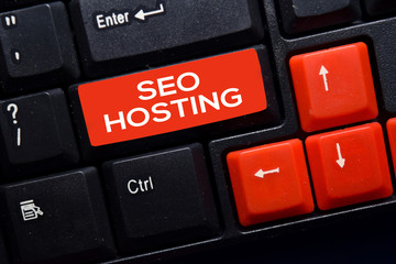SEO Hosting write on keyboard isolated on laptop background