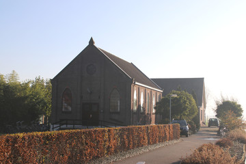 old strict reformed church at the 's-Gravenweg in Nieuwerkerk aan den IJssel in the morning sun in...