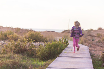 Girl on boardwalk