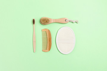 Eco-friendly supplies for personal hygiene. Zero waste composition on green background