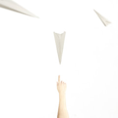 surreal meet between a paper airplane and a hand, concept of fantasy