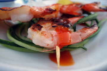 Grilled tasty shrimps with blur effect.