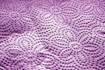 Paper towel surface with blur effect in purple tone.