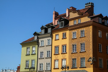 Picture from the streets of the old town in Warsaw in Poland. Detail of the facades of several old houses. 