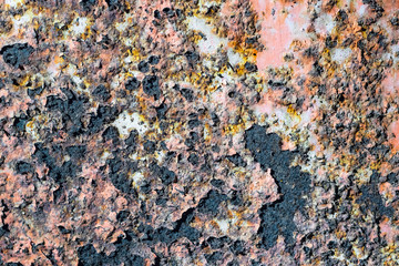 Rusty metal wall with cracked paint, background texture