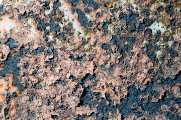 Rusty metal wall with cracked paint, background texture