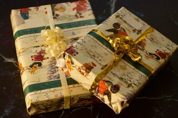Two Christmas presents wrapped in decorative wrapping paper