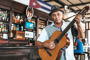 Havana, Cuba - October 18, 2019: Cuban band performing live music in a bar (Dos Hermanos) in...