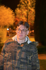 Obraz premium Night Portrait of Man Smiling in the Park