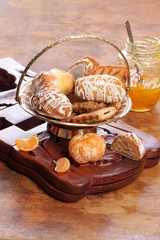 Gingerbread cookie and tangerine jam on wooden background