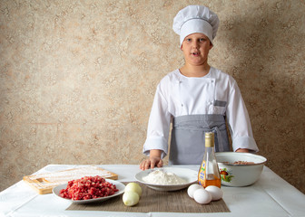 Boy cook in the kitchen