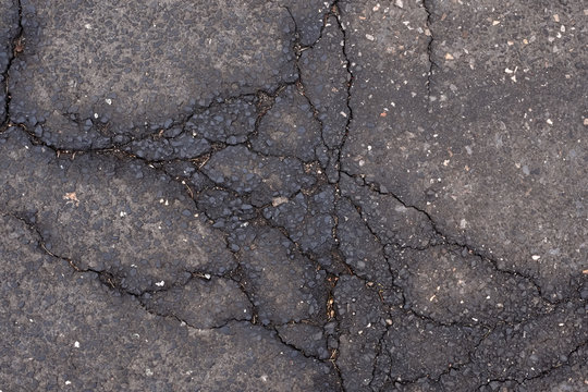 Cracked Old Asphalt, Tarmac Road Top Closeup Shot