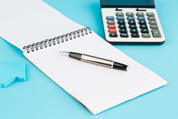 Calculator, pen and notepads