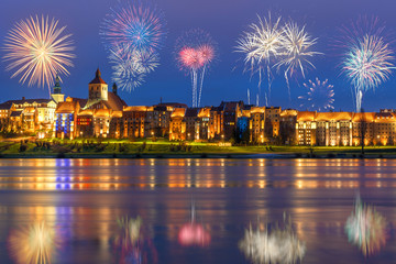 Fototapeta na wymiar New year celebrate fireworks over Old Town of Grudziadz. Poland, Europe