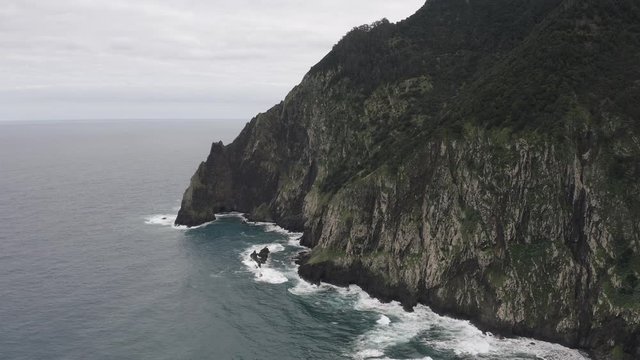Stone cliffs, ocean waves and oceanscape. Aerial top view. 