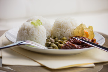 Cooking. White basmati rice on a white plate.
