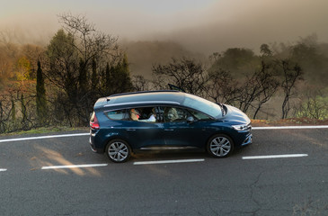 Obraz na płótnie Canvas Car in cloudy mountains mountains Gran Canaria Spain