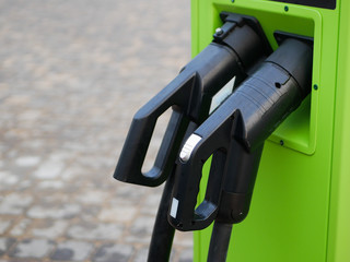 Charging station for electric vehicles. Eco charging station in green. Large view