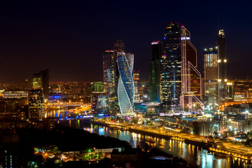 Fototapeta na wymiar Moscow. Russia. Skyscrapers in Moscow at night. Cityscape at night. Panorama of the capital. High-rise buildings on Presnenskaya embankment. Traveling around Moscow. Regions of Russia. Attractions