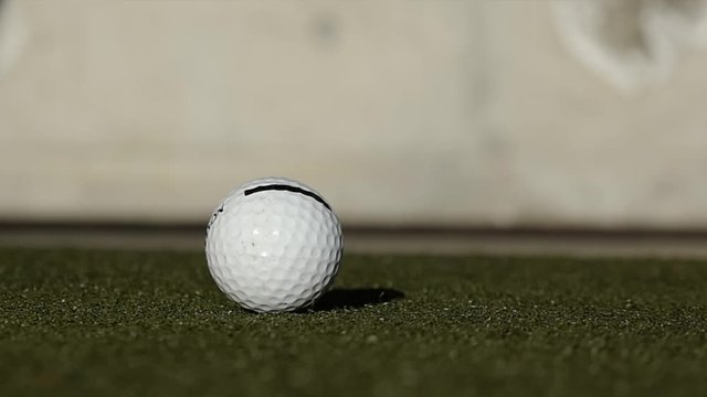 Golf Club Hitting Golf Ball and Camera in Switzerland.