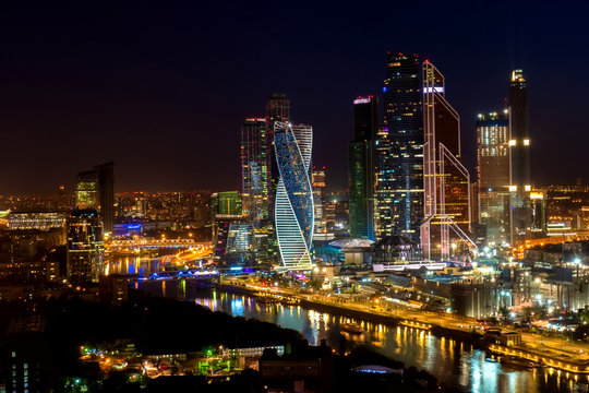 Moscow. Russia. Skyscrapers in Moscow at night. Cityscape at night. Panorama of the capital. High-rise buildings on Presnenskaya embankment. Traveling around Moscow. Regions of Russia. Attractions © Grispb